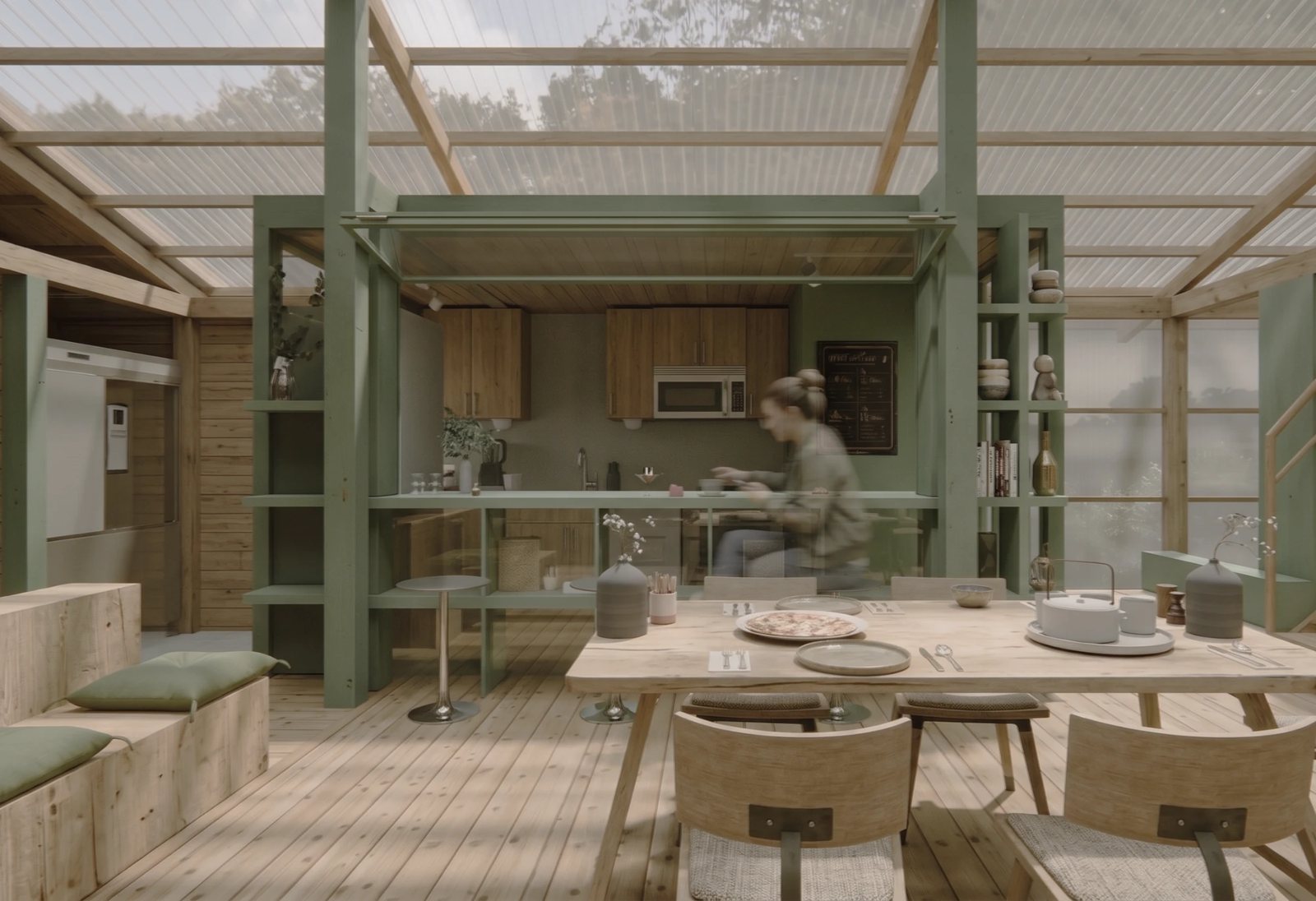 Nordfolk — communal dining table with kitchen counter beyond